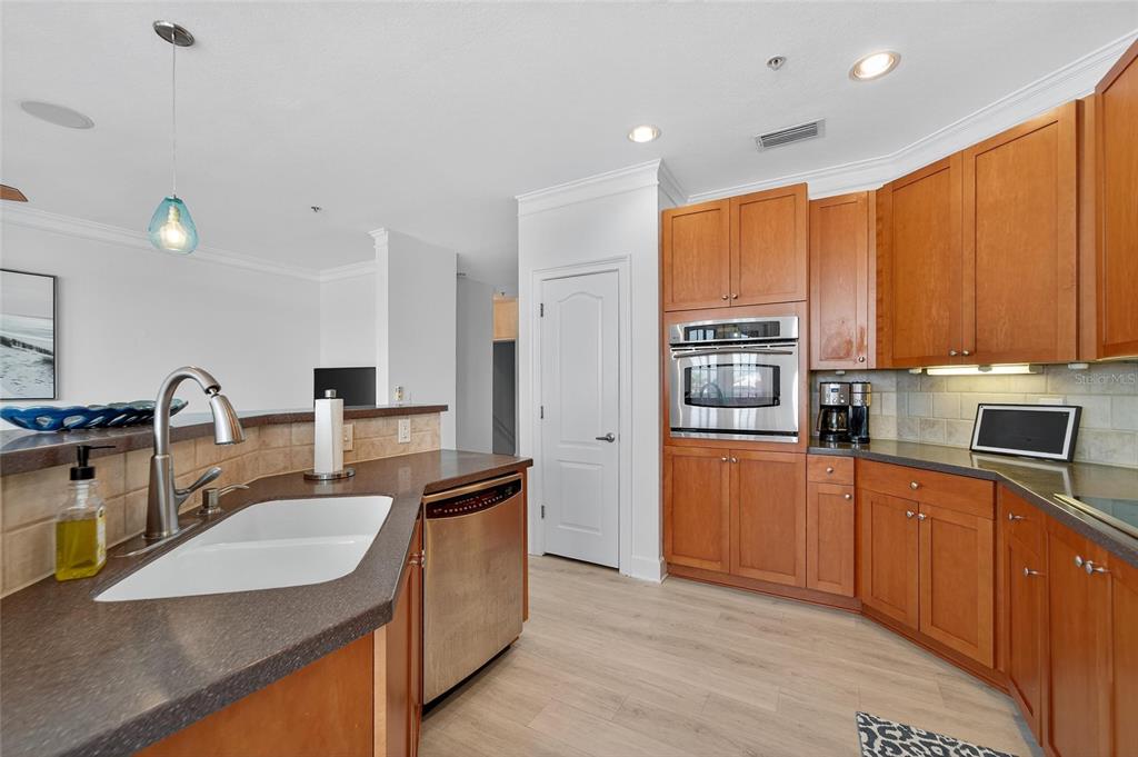 6428 Sunset Bay Circle Apollo Beach, FL 33572 - Photo 23 of 90 a kitchen with stainless steel appliances granite countertop a sink stove and refrigerator