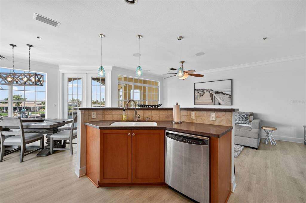 6428 Sunset Bay Circle Apollo Beach, FL 33572 - Photo 25 of 90 a kitchen with stainless steel appliances granite countertop a stove and a wooden floors
