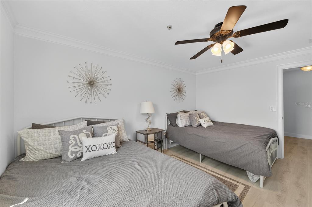 6428 Sunset Bay Circle Apollo Beach, FL 33572 - Photo 47 of 90 a bedroom with a bed and a ceiling fan