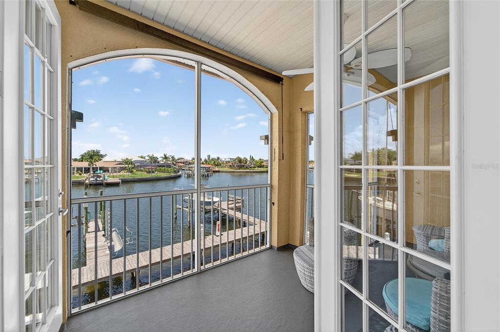 6428 Sunset Bay Circle Apollo Beach, FL 33572 - Photo 5 of 90 a view of a balcony with a floor to ceiling window and wooden floor