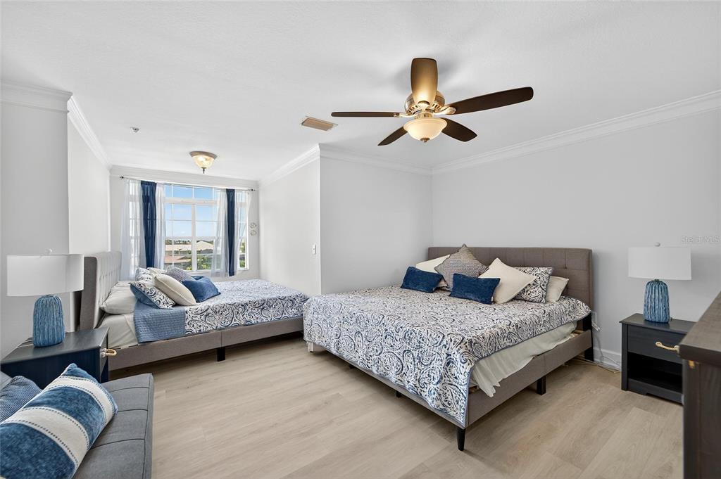 6428 Sunset Bay Circle Apollo Beach, FL 33572 - Photo 54 of 90 a bedroom with a bed couch and window