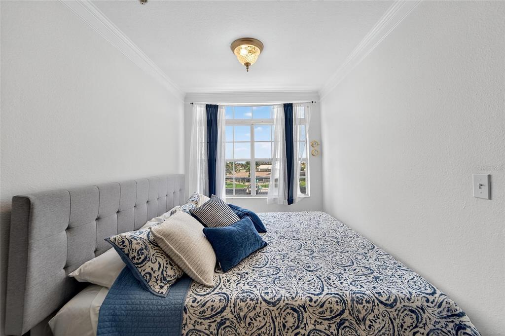 6428 Sunset Bay Circle Apollo Beach, FL 33572 - Photo 56 of 90 a bed sitting in a bedroom next to a window