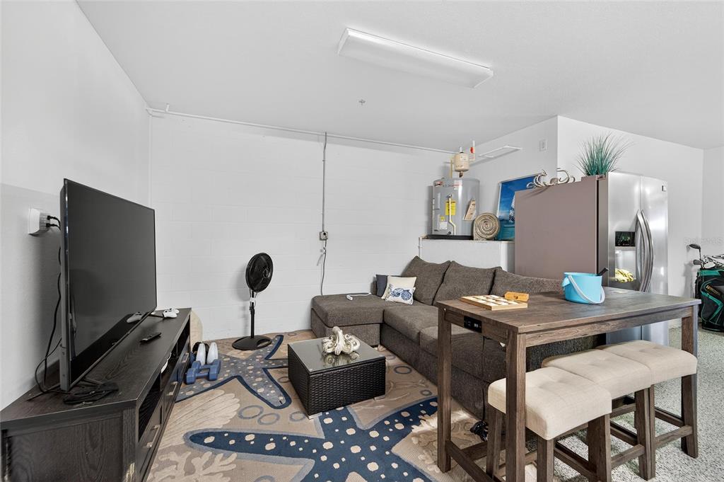 6428 Sunset Bay Circle Apollo Beach, FL 33572 - Photo 60 of 90 a work room with furniture and a flat screen tv