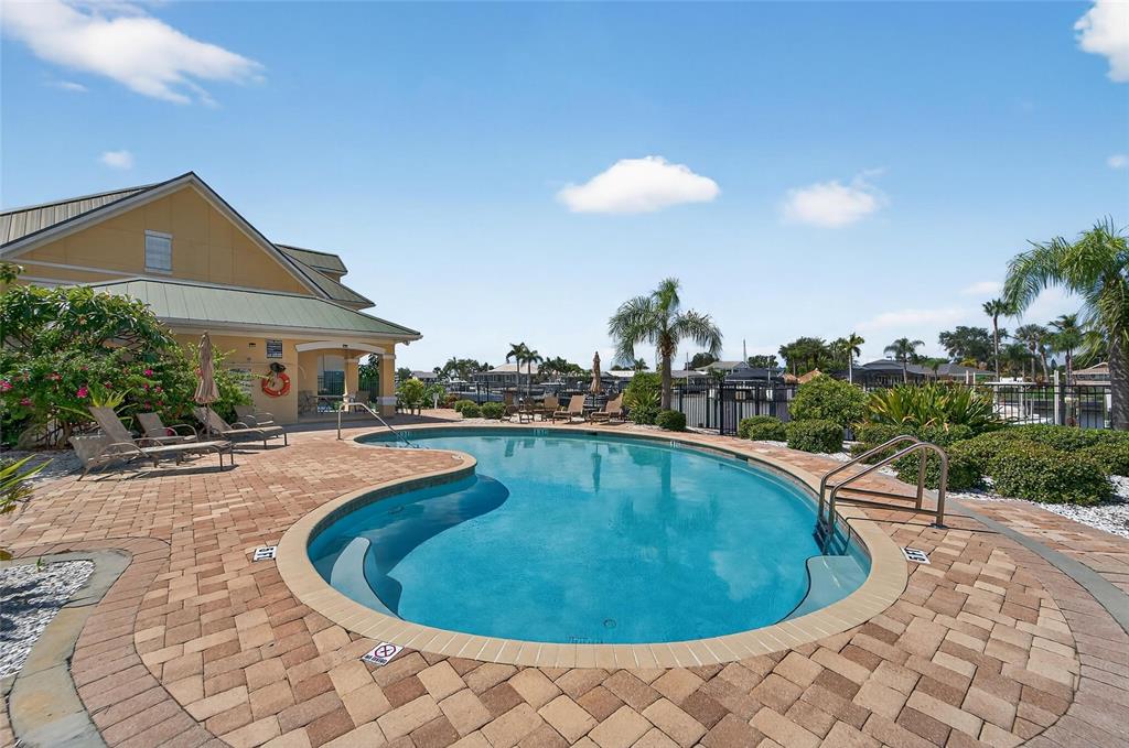 6428 Sunset Bay Circle Apollo Beach, FL 33572 - Photo 71 of 90 a view of a swimming pool with a patio