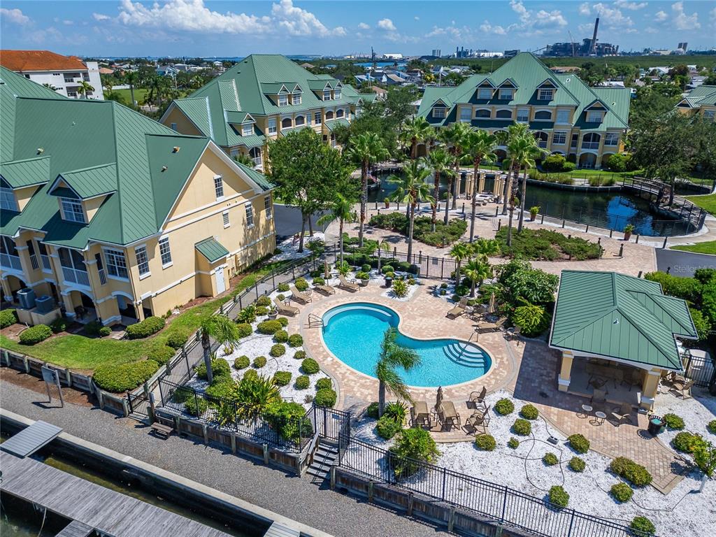 6428 Sunset Bay Circle Apollo Beach, FL 33572 - Photo 79 of 90 an aerial view of a house with a yard and lake view