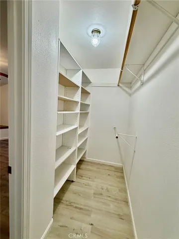 a large kitchen with stainless steel appliances granite countertop a sink and cabinets
