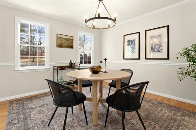 a dining room with furniture and window