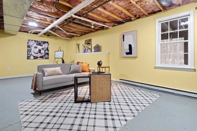 a living room with a couch and a window