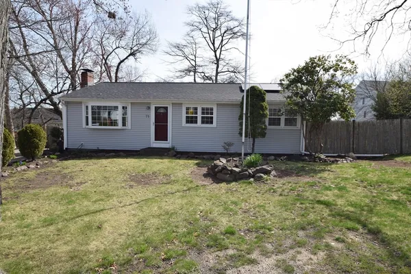 a house with trees in the background