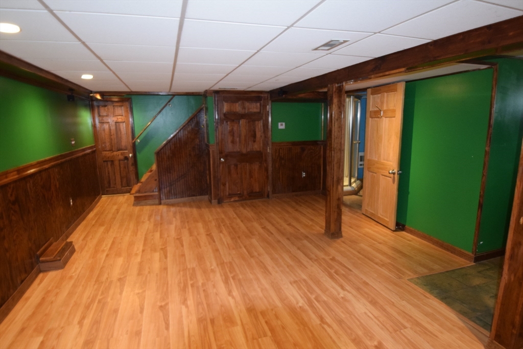 71 Rockefeller Street Randolph, MA 02368 - Photo 13 of 23 a view of empty room with wooden floor