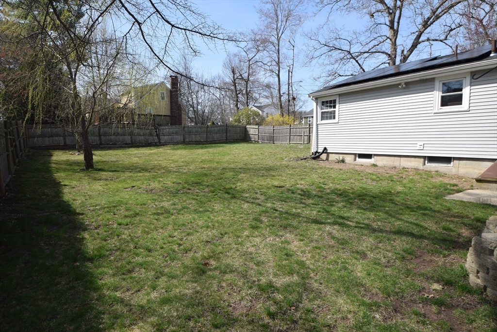 71 Rockefeller Street Randolph, MA 02368 - Photo 18 of 23 a backyard of a house with lots of green space