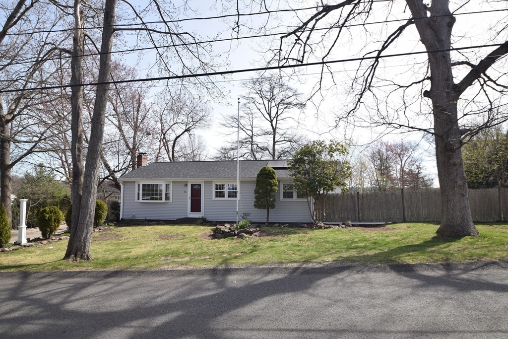 71 Rockefeller Street Randolph, MA 02368 - Photo 22 of 23 front view of a house with a yard and large trees