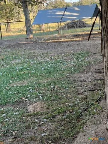 a living room with furniture a flat screen tv and a wall