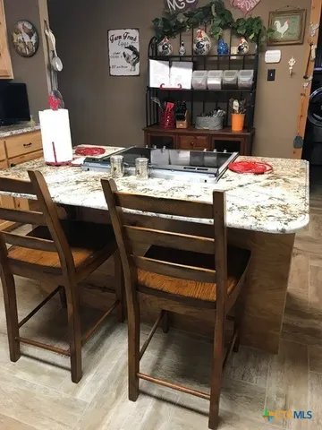 a room that has a table and chairs in it