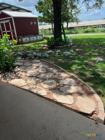 a living room with furniture and a bed