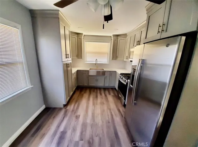 a kitchen with refrigerator a sink and dishwasher