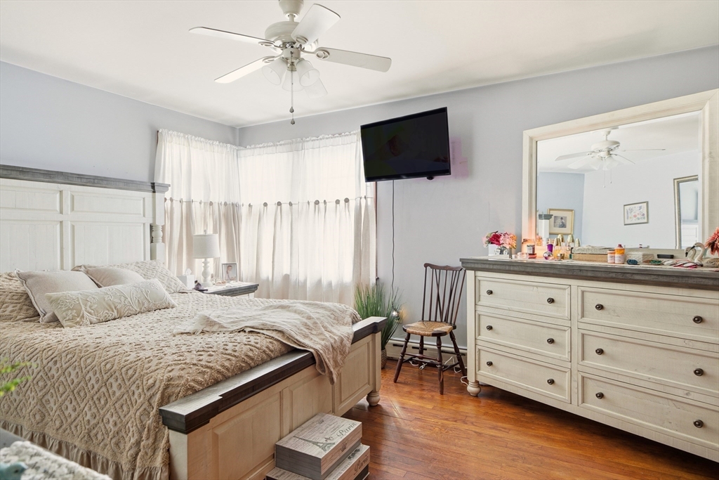 507 R Stafford Road Tiverton, RI 02878 - Photo 12 of 38 a bedroom with a bed a flat screen tv and a dresser