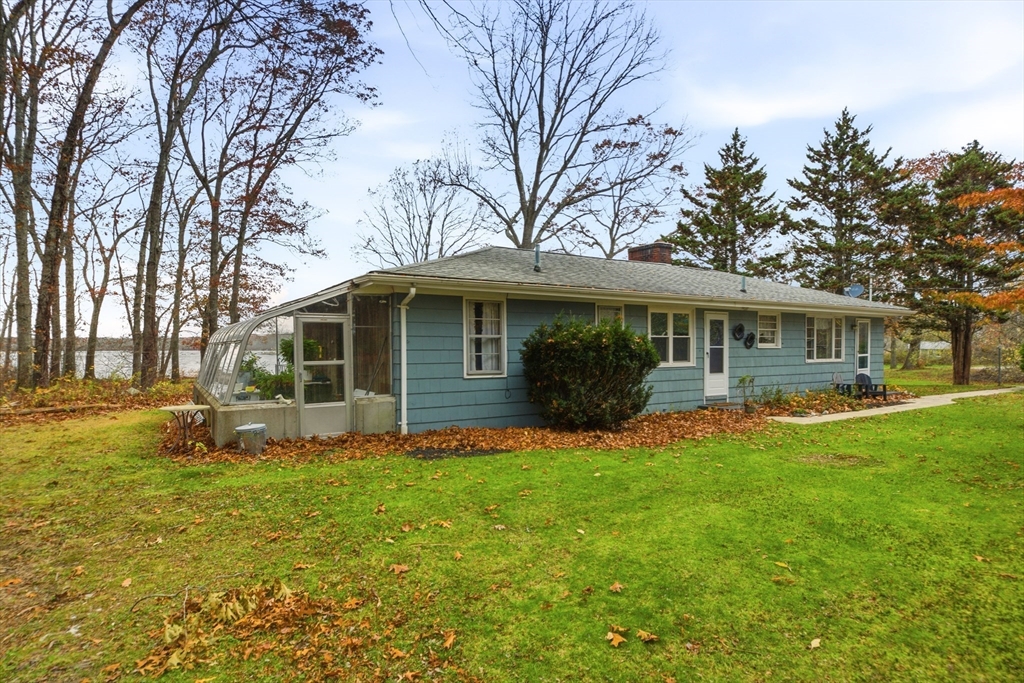 507 R Stafford Road Tiverton, RI 02878 - Photo 17 of 38 a front view of house with yard patio and green space
