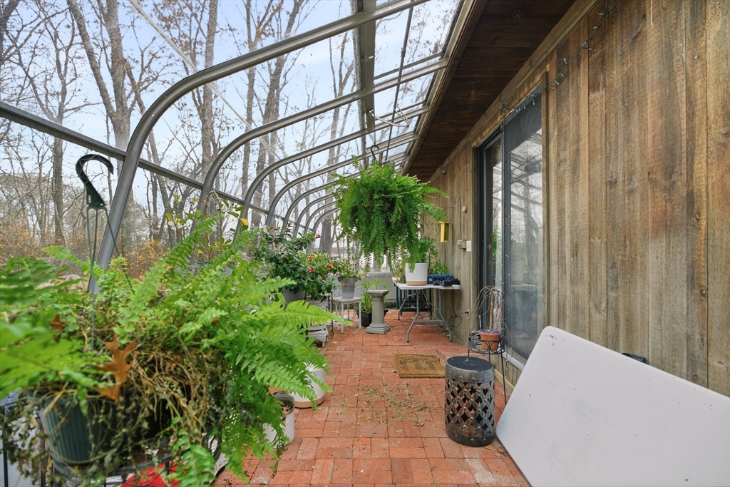 507 R Stafford Road Tiverton, RI 02878 - Photo 18 of 38 a backyard of a house with outdoor seating