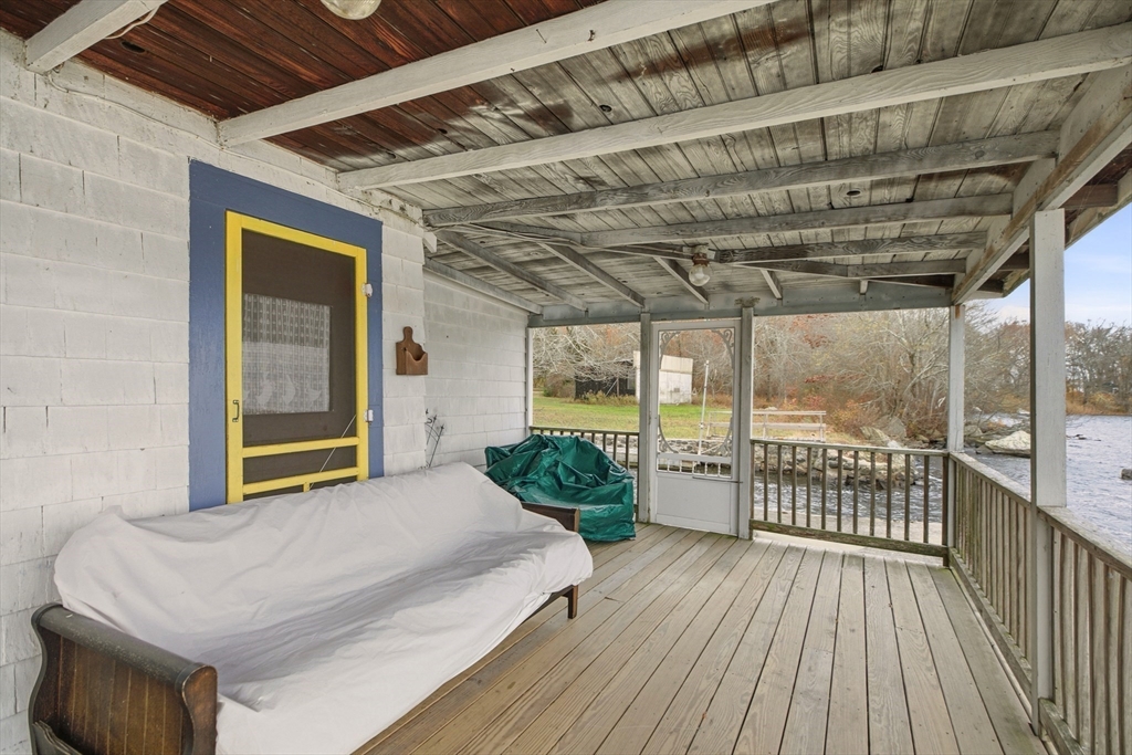 507 R Stafford Road Tiverton, RI 02878 - Photo 21 of 38 a bedroom with a bed and wooden floor