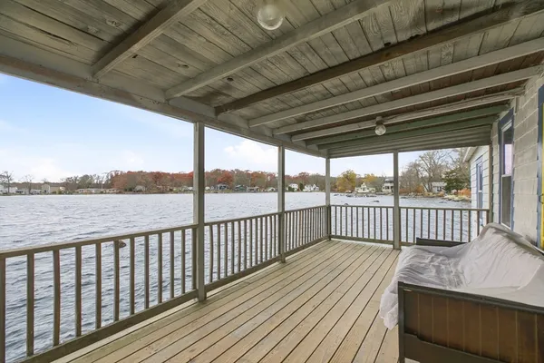 a view of a house with backyard porch and sitting area