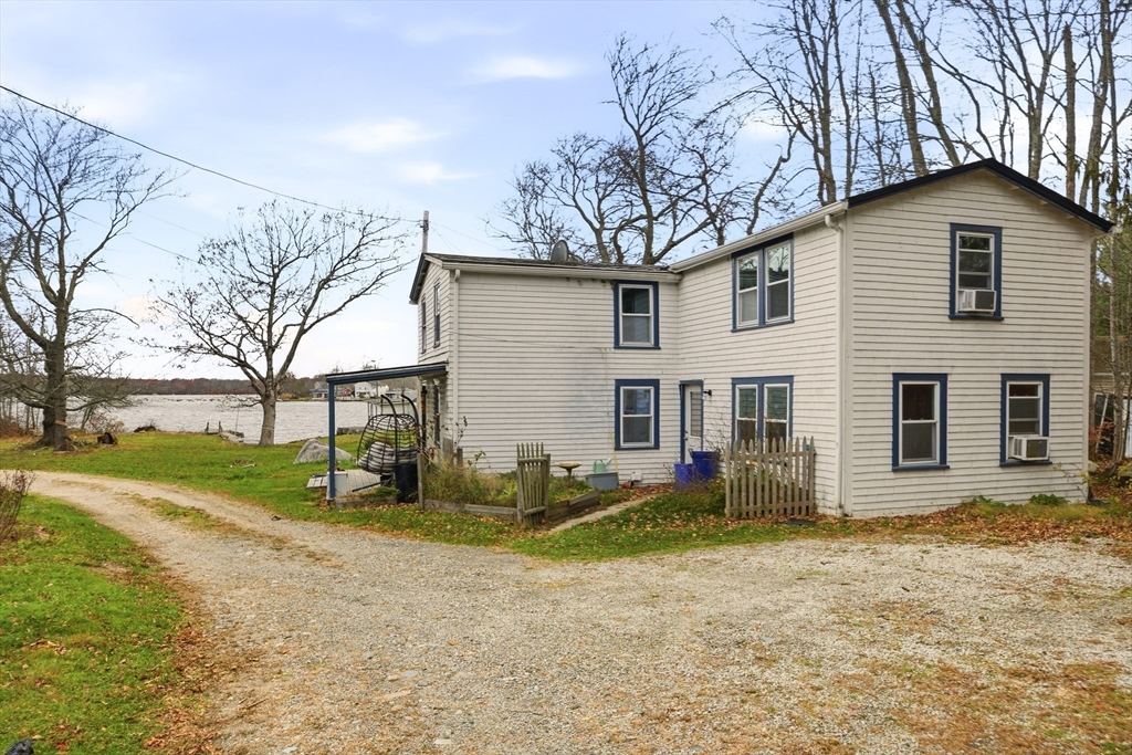 507 R Stafford Road Tiverton, RI 02878 - Photo 25 of 38 a view of a house with a yard covered in snow