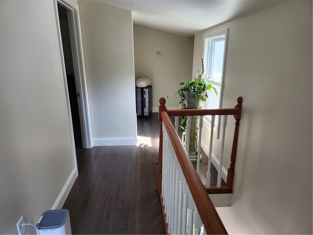 507 R Stafford Road Tiverton, RI 02878 - Photo 29 of 38 a view of a hallway with wooden floor and stairs