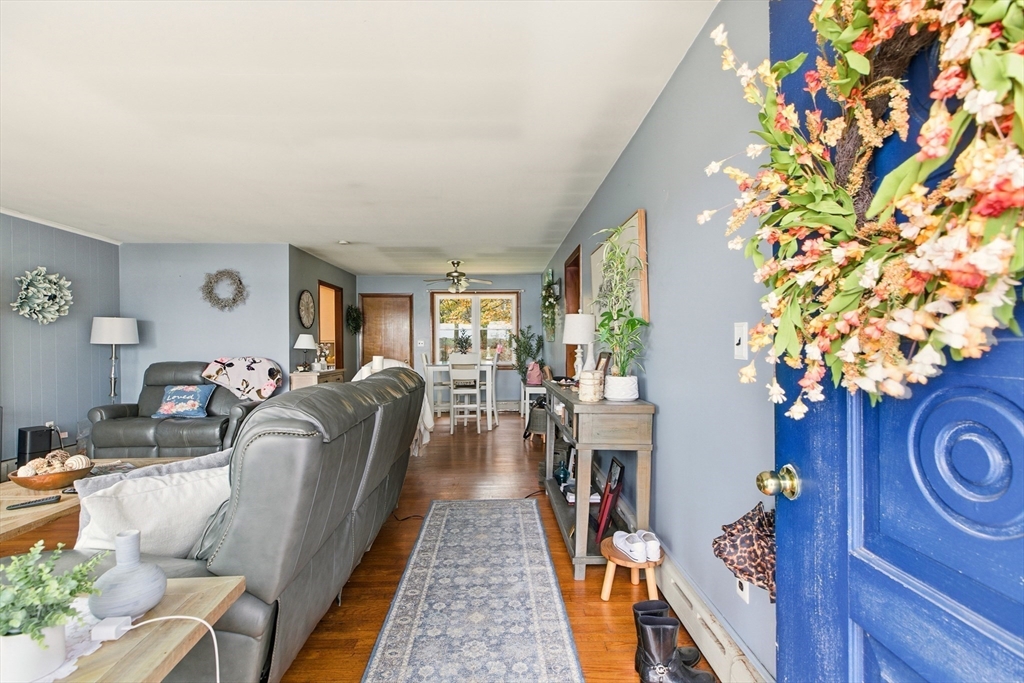 507 R Stafford Road Tiverton, RI 02878 - Photo 7 of 38 a living room with furniture and a potted plant
