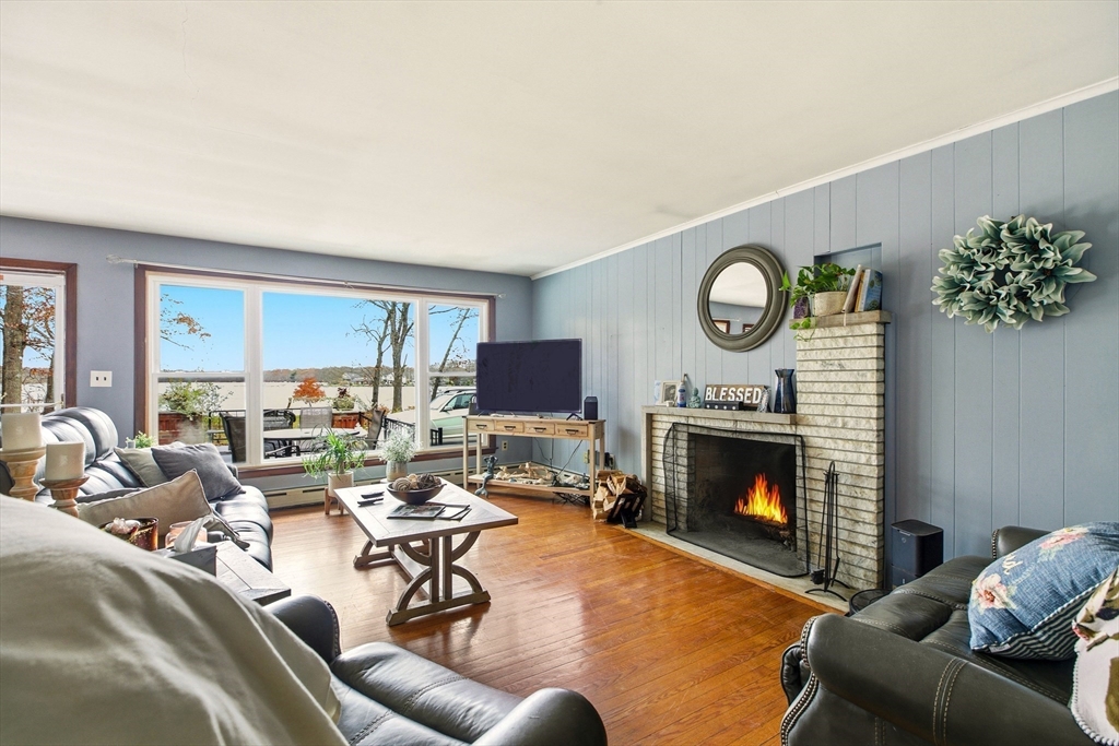 507 R Stafford Road Tiverton, RI 02878 - Photo 8 of 38 a living room with furniture and a fireplace