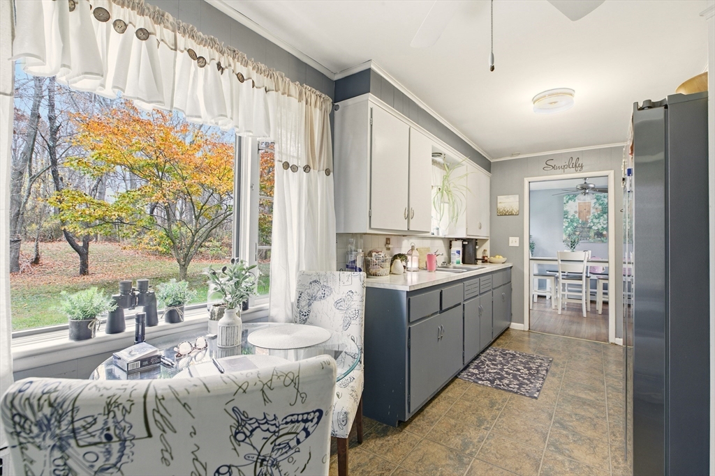 507 R Stafford Road Tiverton, RI 02878 - Photo 10 of 38 a large white kitchen with a large window and sink