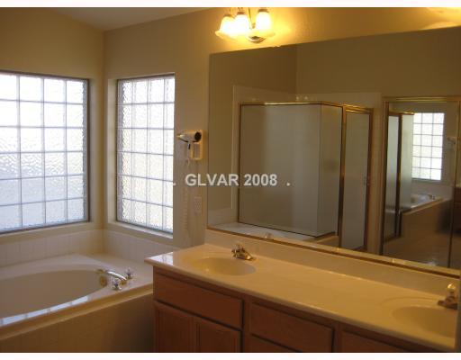 1759 Quiver Point Avenue Henderson, NV 89012 - Photo 8 of 12 Master Bath/Spa. Dual Sinks! Garden tub! Stand alone shower! Walk in closet with mirrored doors!