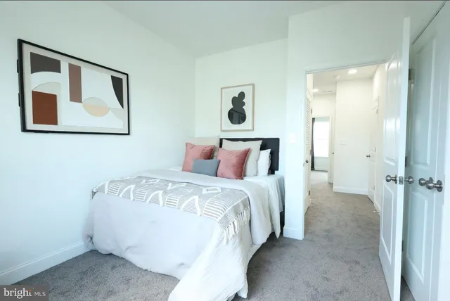 a bed room with a bed and a painting