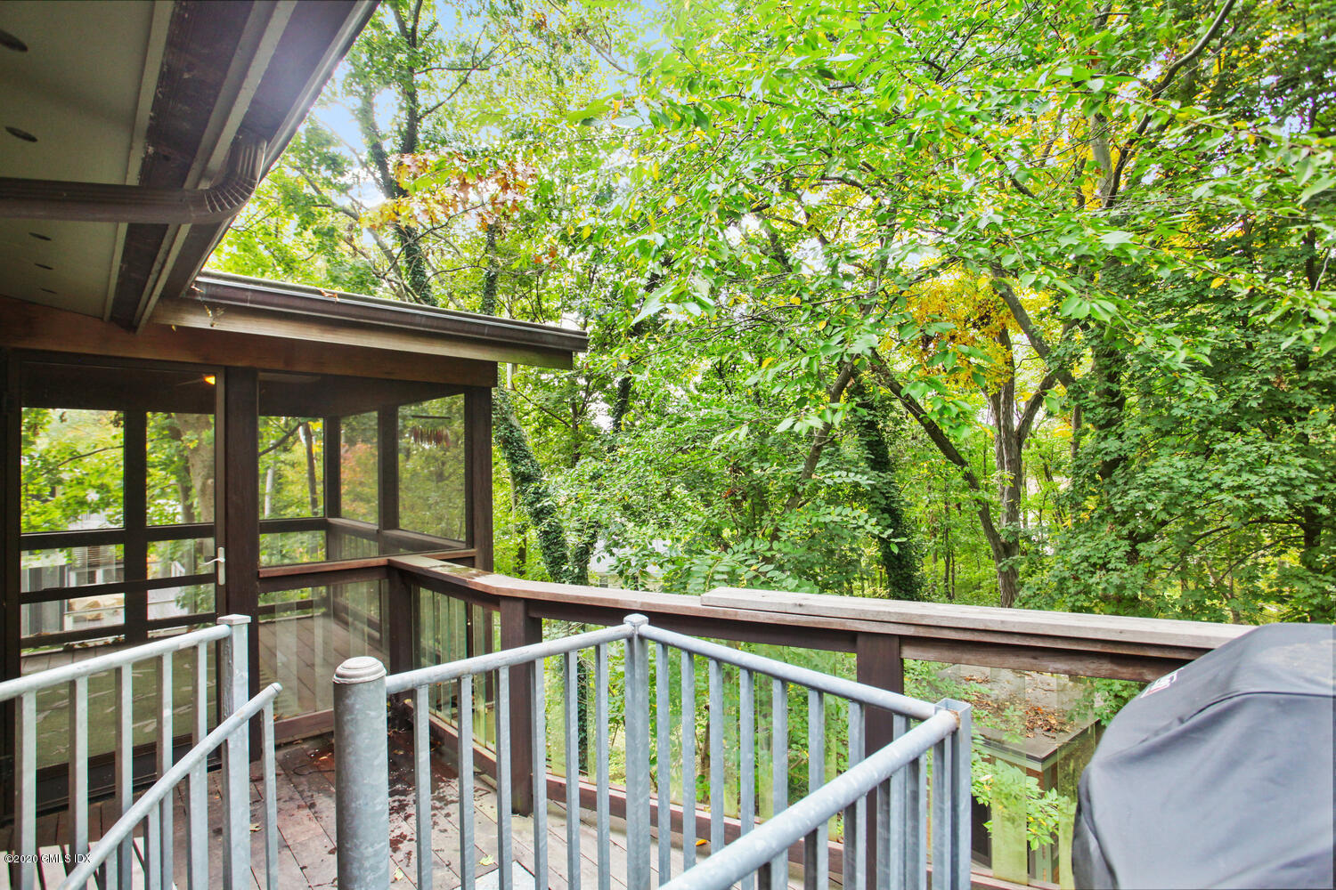 39 Crawford Terrace Riverside, CT 06878 - Photo 27 of 37 a view of roof deck with large trees and wooden fence