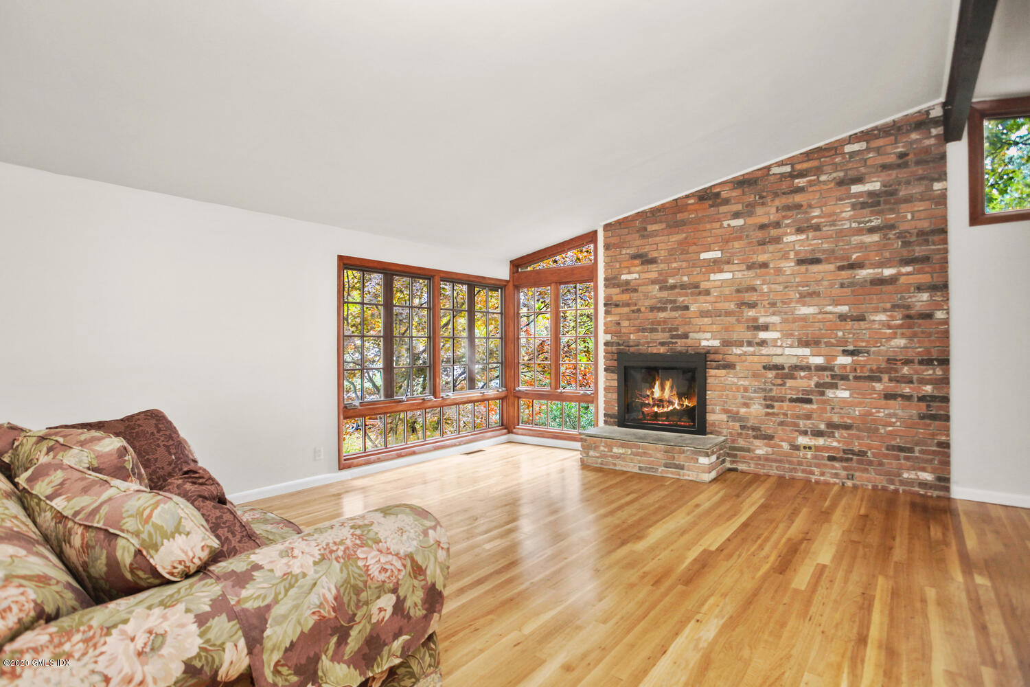 39 Crawford Terrace Riverside, CT 06878 - Photo 3 of 37 a spacious bedroom with a bed and a fireplace