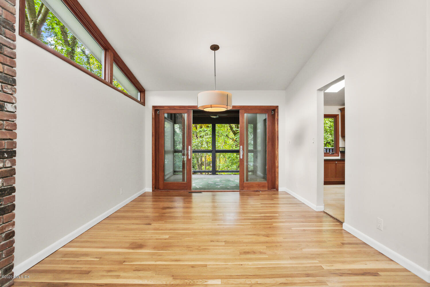 39 Crawford Terrace Riverside, CT 06878 - Photo 7 of 37 a view of an empty room with wooden floor and fan