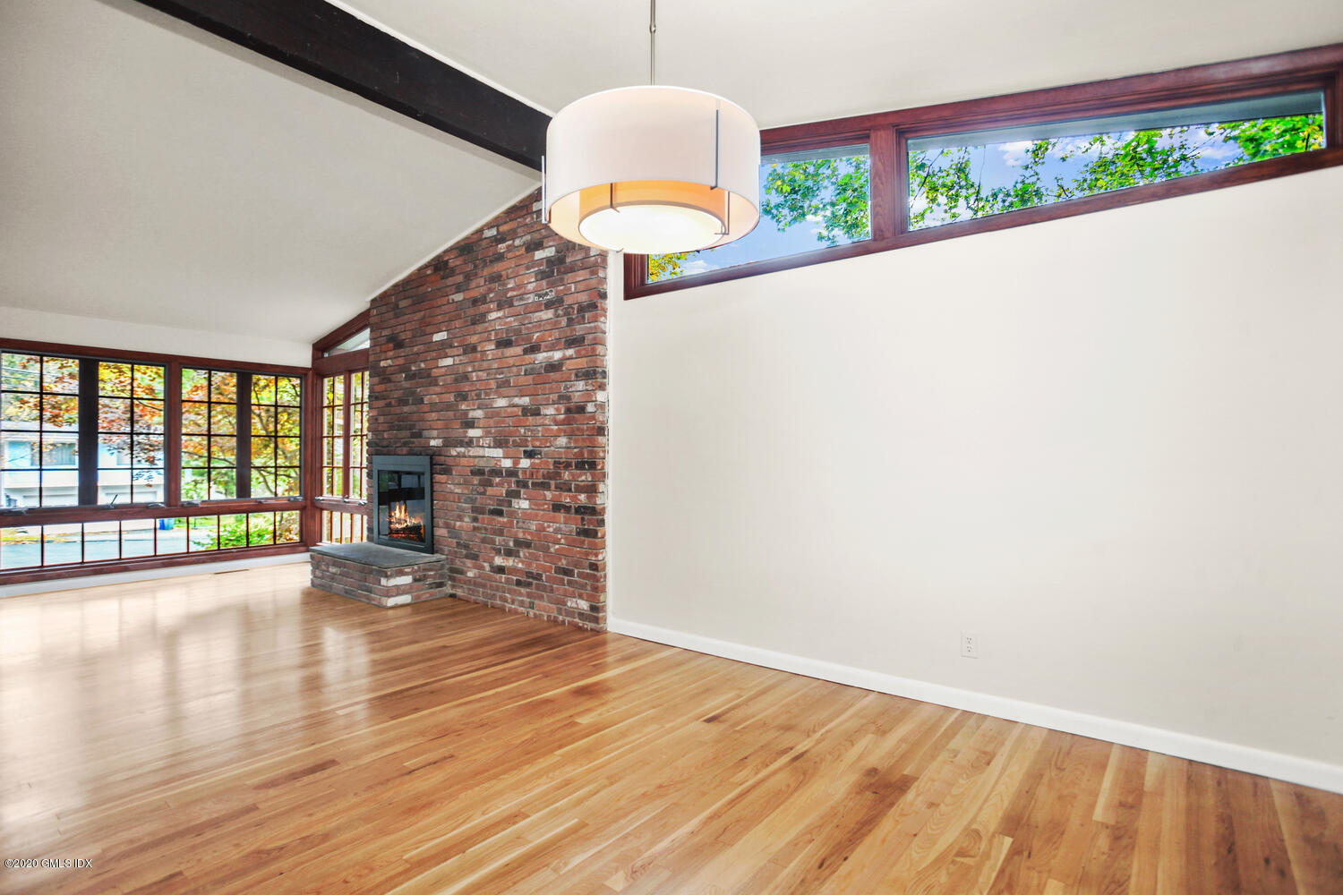 39 Crawford Terrace Riverside, CT 06878 - Photo 8 of 37 an empty room with wooden floor and windows