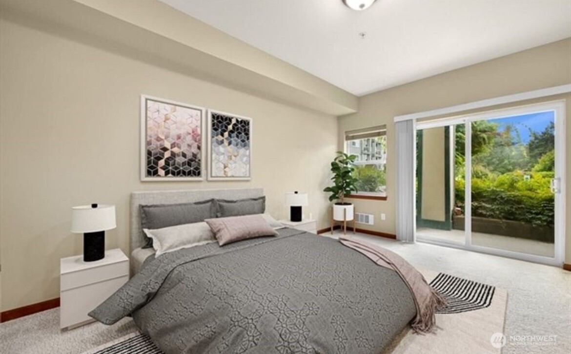 259 West Bakerview Road, Unit C102 Bellingham, WA 98226 - Photo 11 of 29 a bedroom with a large bed and a couch