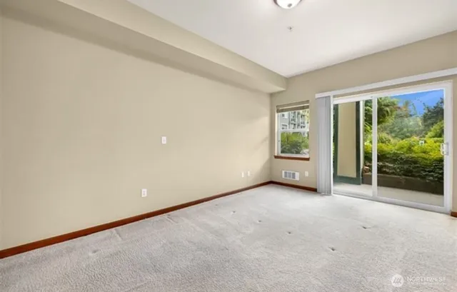 a view of a room with large windows