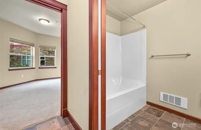 a view of an empty room and window