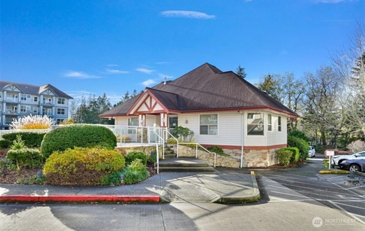 259 West Bakerview Road, Unit C102 Bellingham, WA 98226 - Photo 21 of 29 a front view of a house with a yard