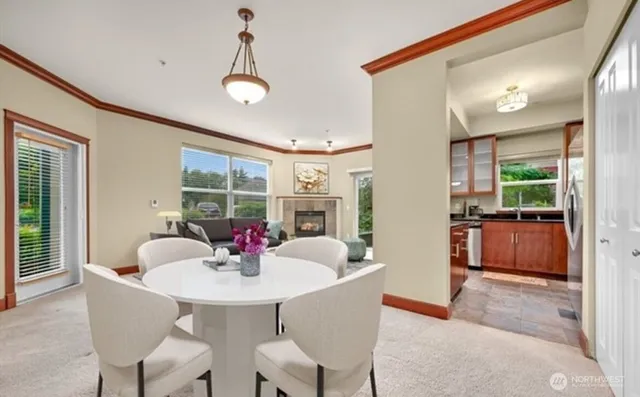 a dining room with furniture a livingroom and chandelier