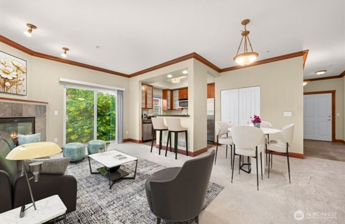 259 West Bakerview Road, Unit C102 Bellingham, WA 98226 - Photo 6 of 29 a living room with furniture a fireplace and a large window