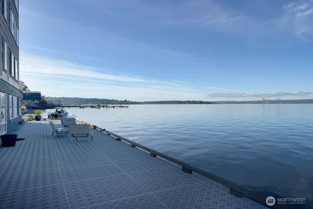 a view of terrace with seating space and lake view