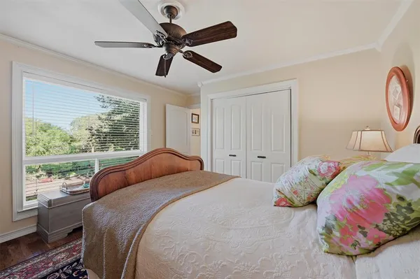 a bedroom with a bed and window