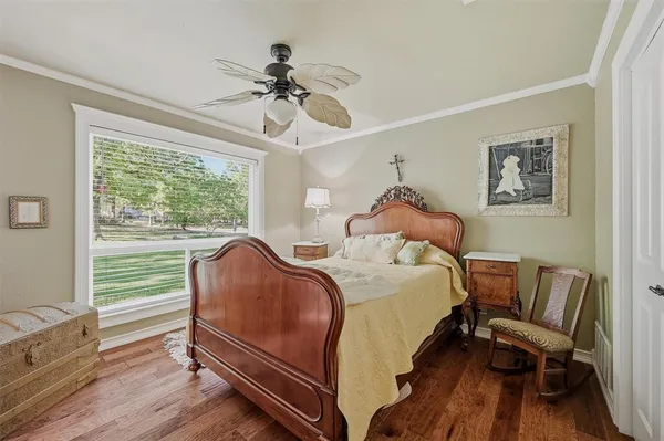 a bed room with a bed and a chair