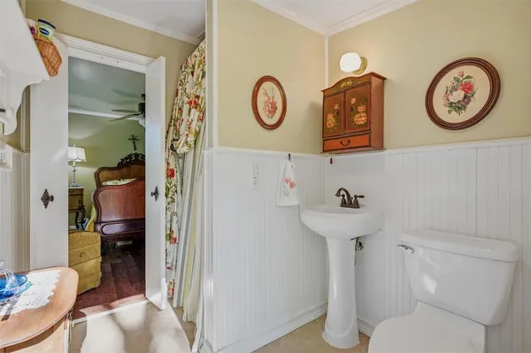 a bathroom with a toilet and a sink