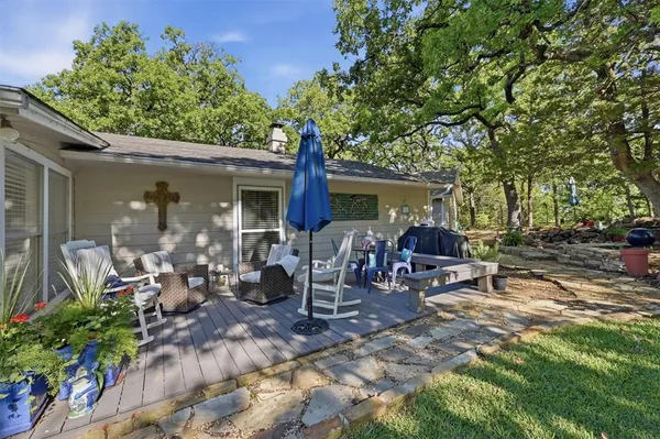a view of a chairs and tables in a patio