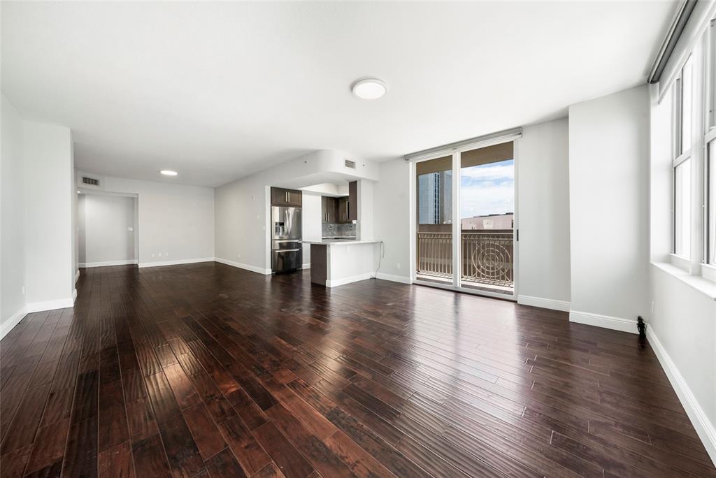 511 Southeast 5th Avenue, Unit 1116 Fort Lauderdale, FL 33301 - Photo 21 of 45 a view of an empty room with wooden floor and a window