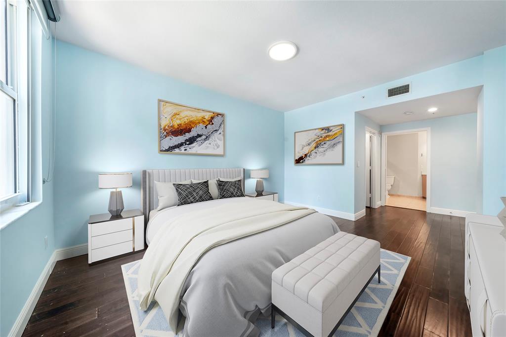 511 Southeast 5th Avenue, Unit 1116 Fort Lauderdale, FL 33301 - Photo 24 of 45 a bedroom with a bed and a painting on the wall