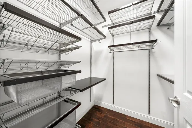 a view of storage and utility room with wooden floor